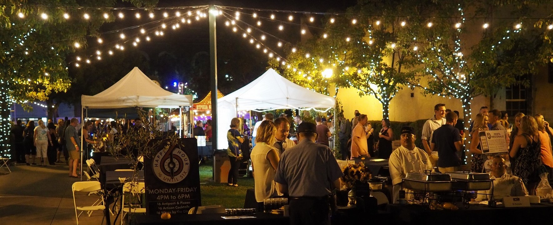 alt="event at night in plaza with lights"